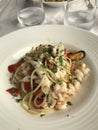 Plate of seafood Ã¢â¬Ëspaghetti allo scoglioÃ¢â¬â¢ pasta in a restaurant on the Italian Riviera